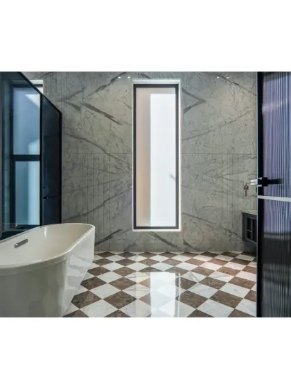 A bathroom that feels like a modern art gallery. I used book-matched marble slabs to create a stunning feature wall, complemented by a bold checkerboard floor and a freestanding bathtub for a truly luxurious feel.