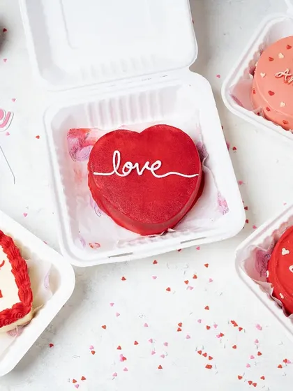 A collection of Valentine's Day bento cakes with different messages. This showcases the variety and customization options available from the bakery.