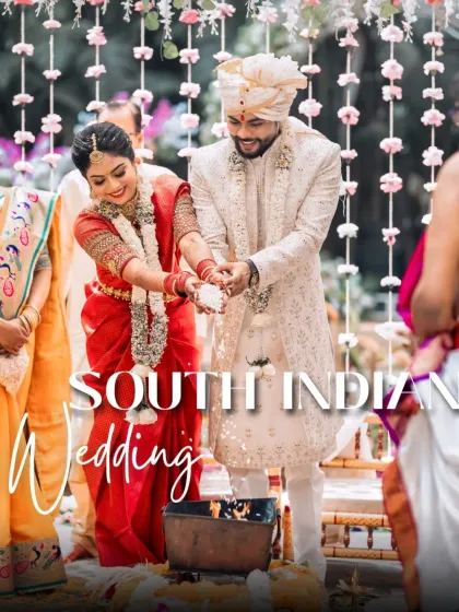 A beautiful moment from a South Indian wedding ceremony, where the couple participates in a traditional ritual together.