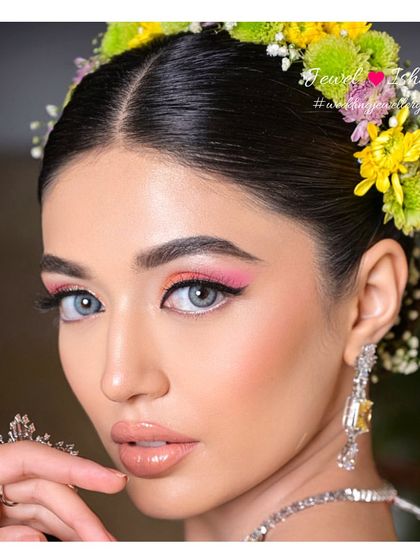 A beauty shot highlighting the bride's glowing makeup and our sparkling yellow diamond earrings. The earrings are designed to be lightweight so you can celebrate in comfort all day long.