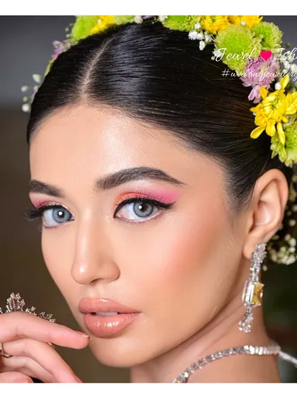 A beauty shot highlighting the bride's glowing makeup and our sparkling yellow diamond earrings. The earrings are designed to be lightweight so you can celebrate in comfort all day long.