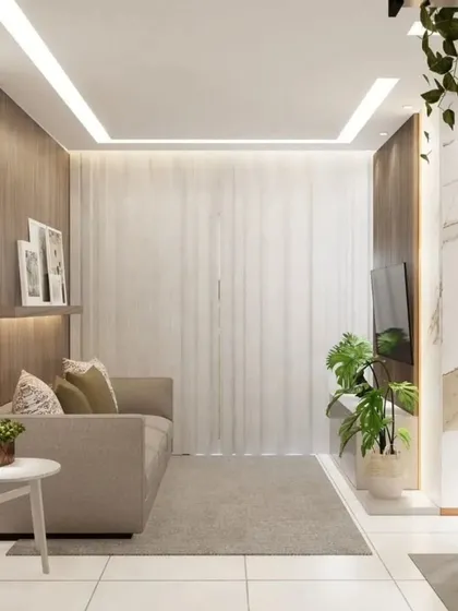 This view showcases the full living area, with a focus on the interplay of light and texture. The sheer curtains and strategic lighting create a bright and welcoming space.