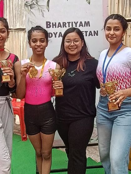 More moments of triumph from various competitions, showcasing our gymnasts with their medals, trophies, and proud coaches.