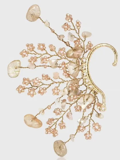 This delicate branch earcuff is made with peach-toned beads and agate stones, perfect for a subtle statement.