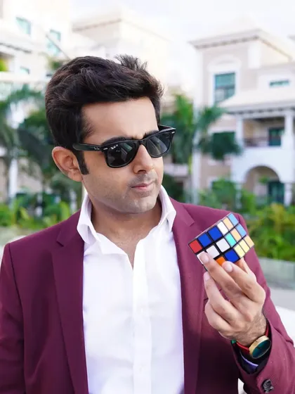 Holding a solved Rubik's Cube. For me, it represents the idea that even the most complex chaos has a solution, and sometimes you're just one twist away from finding it.