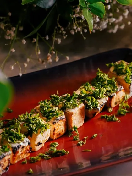 This is my Paneer Ajamod Tikka, a unique dish where paneer is grilled and topped with a generous amount of fresh, herby ajamod (celery). It's a fresh and aromatic take on paneer tikka.