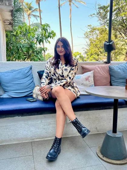 Enjoying the outdoors in my animal print dress and combat boots. This outfit is all about combining a feminine dress with tough accessories for a balanced look.