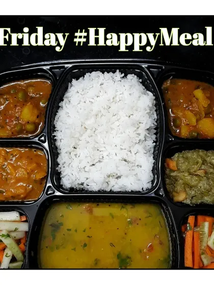 This Friday Happy Meal has dal, rice, peru (guava) sabzi, aloo mutter, sweet dudhi halwa, and a fresh salad.