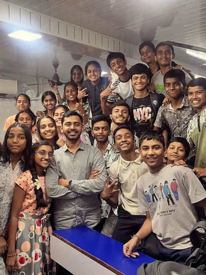Our mentor, Maneesh Sir, with a group of students dressed in grey for Day 6 of Navratri, symbolizing strength and balance.