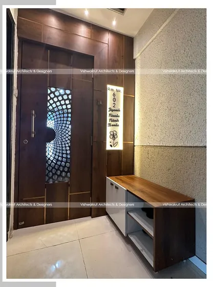 This image shows the entrance door and shoe rack from a different angle, highlighting how the design provides a clean and organized entryway.
