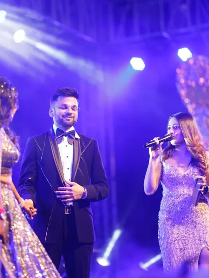 Interacting with the bride and groom on their Sangeet stage in Jaipur. I make sure to have personal, fun conversations with them to make them feel comfortable and celebrated.