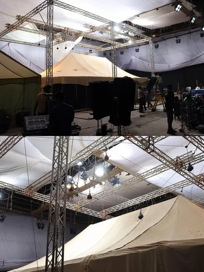 A wide shot of the tent setups inside the 'Chhaava' studio, with our lighting rigs built above and around them.