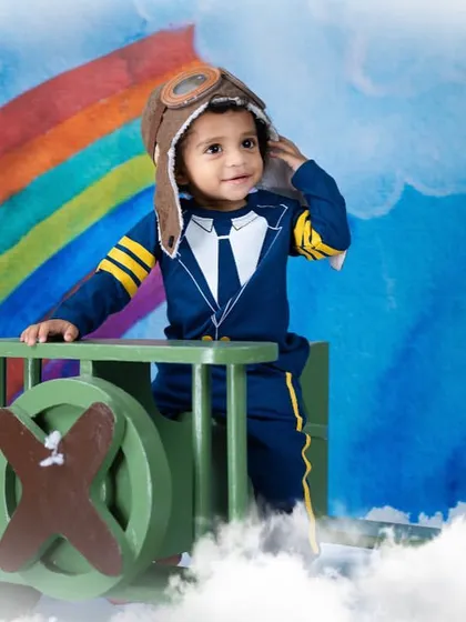 Looking out towards the horizon, this little aviator is ready for his next adventure. The vintage-style hat completes the look perfectly.
