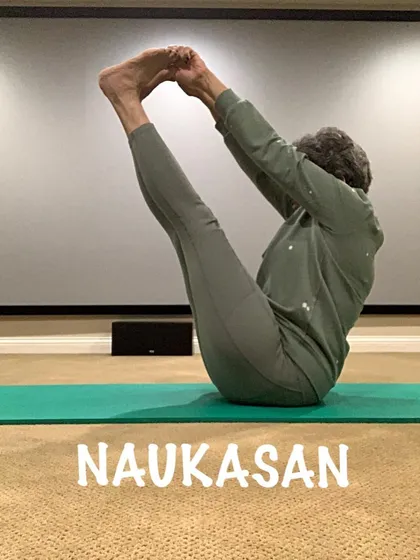 This variation of boat pose shows my focus and determination. Building a strong core is essential for overall fitness.