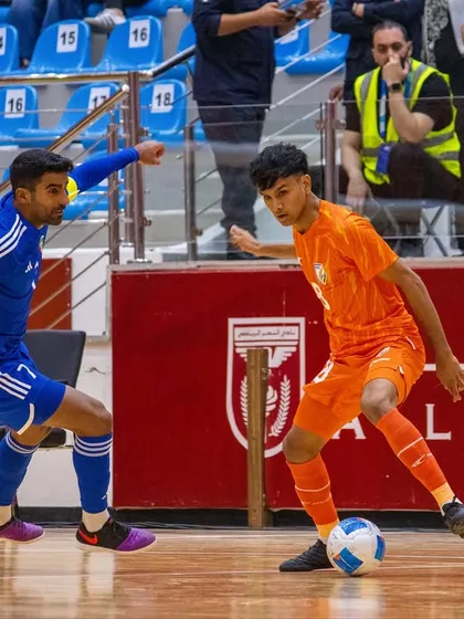 A player from our club skillfully dribbling past an opponent while representing India against Kuwait.