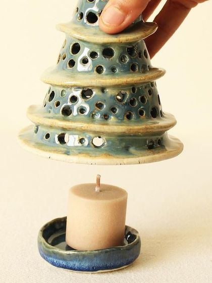 This view shows how a candle fits perfectly into the base of the Winter Wonderland luminary. It's a simple, two-piece design that is easy to use.