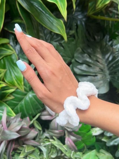 My classic white velvet scrunchie, a versatile accessory that goes with any outfit. It’s soft, stretchy, and handmade to be durable.