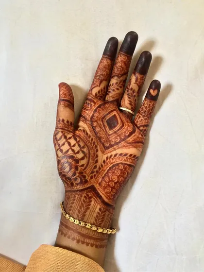This geometric and checkerboard pattern developed into a fantastic dark stain. You can even see the tiny heart detail I added to the ring finger.