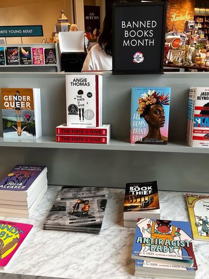 A display of banned books at a bookstore. It's a powerful statement on the importance of intellectual freedom and the inclusivity of the excluded.