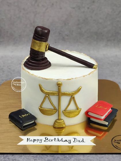 A classic law cake for a dad's birthday, featuring a gavel and the scales of justice.