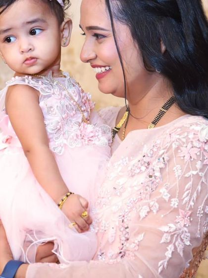 A mother's love. Our client looks beautiful in her embellished gown while celebrating her daughter's special day.