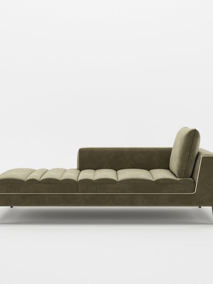 A side profile of our elegant chaise lounge, highlighting its clean lines, tapered legs, and contrasting piping detail for a refined finish.