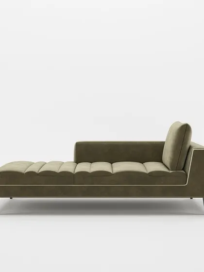 A side profile of our elegant chaise lounge, highlighting its clean lines, tapered legs, and contrasting piping detail for a refined finish.