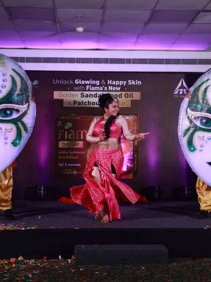 We love using larger-than-life props to make a statement. Here, a solo performer is flanked by two dancers in giant, ornate mask costumes for an ITC Fiama product launch, demonstrating our ability to create unique, branded entertainment.