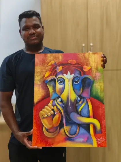 A student holds his vibrant, modern Ganesha painting. This piece combines bold colors with textured knife work, showing how traditional subjects can be interpreted with contemporary techniques.