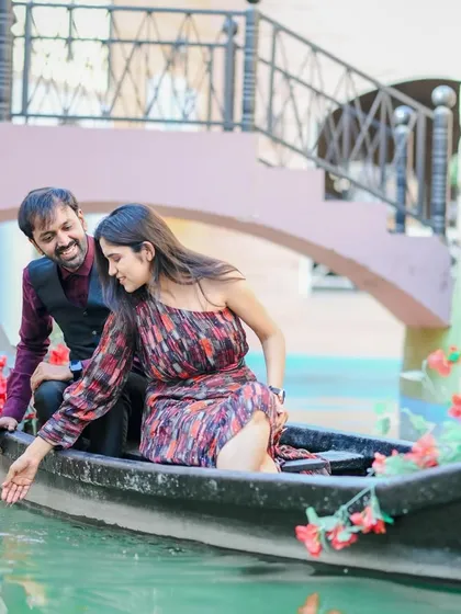 A playful and romantic moment captured in a gondola on a Venice-themed set. This shows how we can create a destination feel without leaving the city, perfect for a themed pre-wedding shoot.