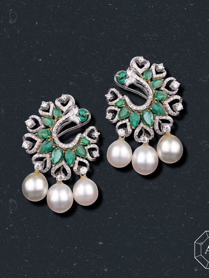 These emerald and pearl earrings are for desires meant to be fulfilled, speaking through their vibrant green.