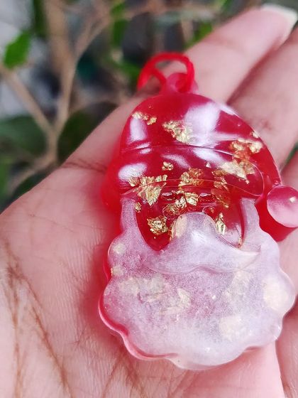 Add some sparkle to your tree with these resin Christmas ornaments. I make them in various shapes like snowflakes, angels, and candy canes, filled with glitter and color.