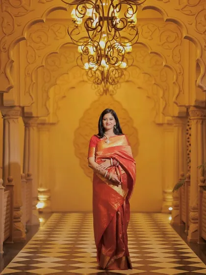 A full-length shot showcasing her stunning saree and the flawless makeup that completes the look.