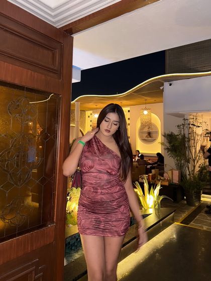 A candid walking shot in the party dress.