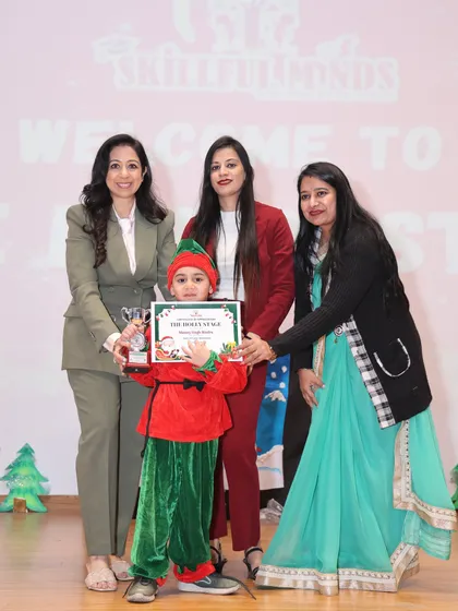 A proud moment from our Christmas show, 'The Holly Stage', with one of our young performers receiving an award from our chief guest.