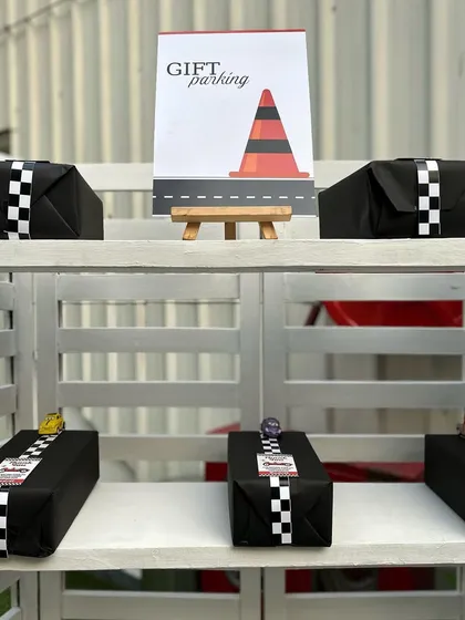 "Gift Parking" is a clever and cute detail for a race car party. It's these small touches that make our themed parties so memorable.