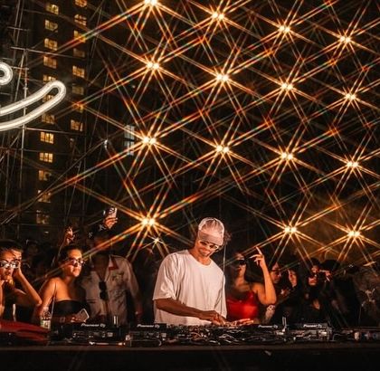 A stunning shot of &ME at the decks, with a starburst filter effect on the lights creating a dazzling, magical atmosphere.