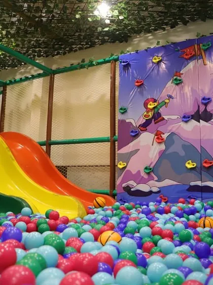 The triple slide is a highlight, allowing multiple kids to slide down into the giant ball pit at once. It's perfect for races and shared fun.
