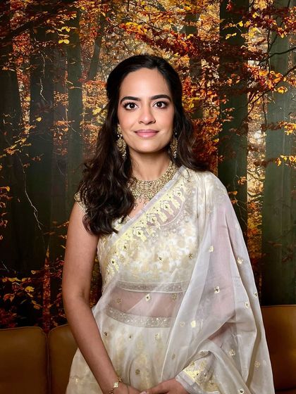 This look is the perfect checklist for bridesmaid makeup. We have neutral eyes, a glossy nude lip, a sheer radiant complexion, and beautiful wavy hair pinned up softly.