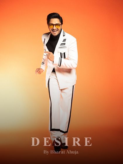 A dynamic pose in the white and black striped co-ord set, showing how it moves with the wearer.