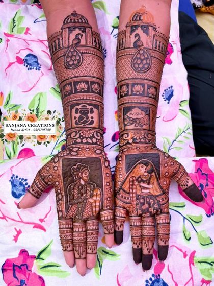 This is the ultimate storytelling mehndi. It features portraits of the Maratha king Shivaji Maharaj and the bride, along with palace motifs, a Ganesh figure, and the couple's names.