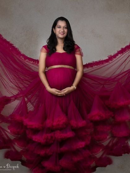 The full spread of this incredible magenta gown. The way the fabric fans out creates a breathtaking effect that is pure art.
