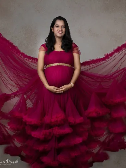 The full spread of this incredible magenta gown. The way the fabric fans out creates a breathtaking effect that is pure art.