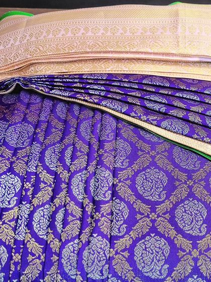 A rich purple bridal saree, showing the beautiful texture of the silk.