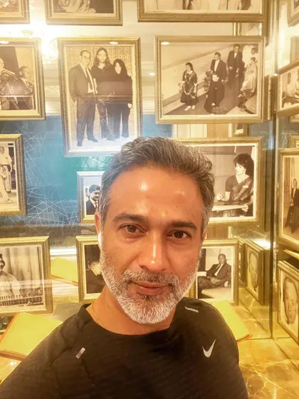 In the 'corridor of power' at the Taj Mahal Palace, Mumbai, surrounded by portraits of giants. I draw motivation from the legacies of great leaders who have shaped our nation.