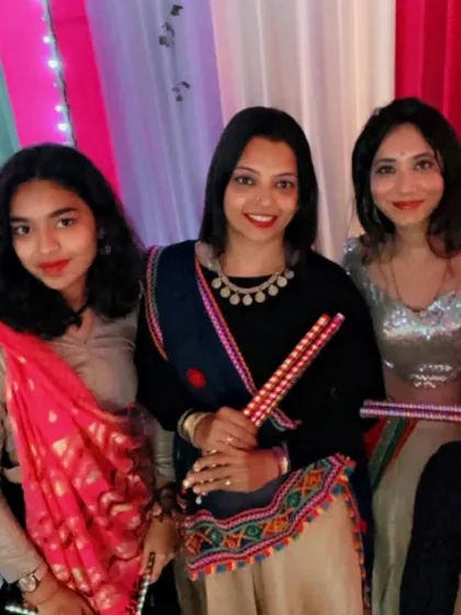 A group photo with guests, capturing the happy moments of a fun-filled Garba night.
