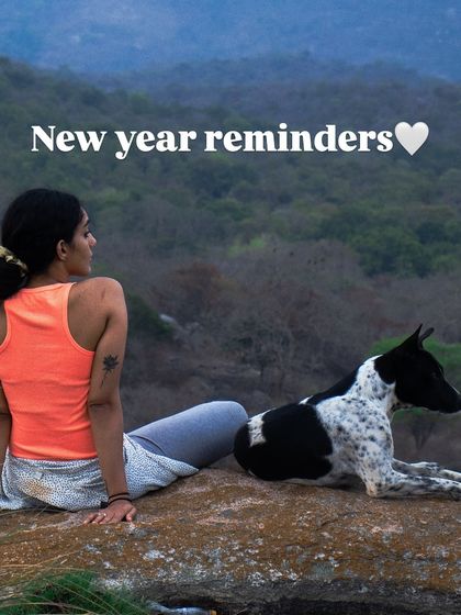 A New Year's reminder to choose yourself. This image, showing me sitting with a dog in nature, symbolizes companionship on the journey of prioritizing your own dreams and well-being.