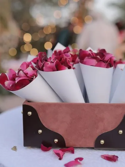 The smallest details often make the biggest impact. For this event, I prepared these elegant paper cones filled with fresh rose petals, allowing guests to shower the couple with blessings in a beautiful and photogenic way.