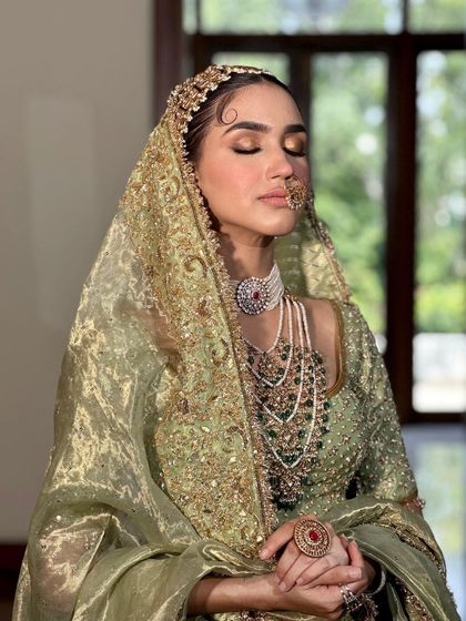 A serene, eyes-closed shot of the masterclass model, highlighting the beautiful blend of the eyeshadow and the radiant skin finish.