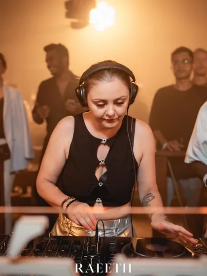 In the zone at the DJ console at Raeeth, with the crowd visible in the background.